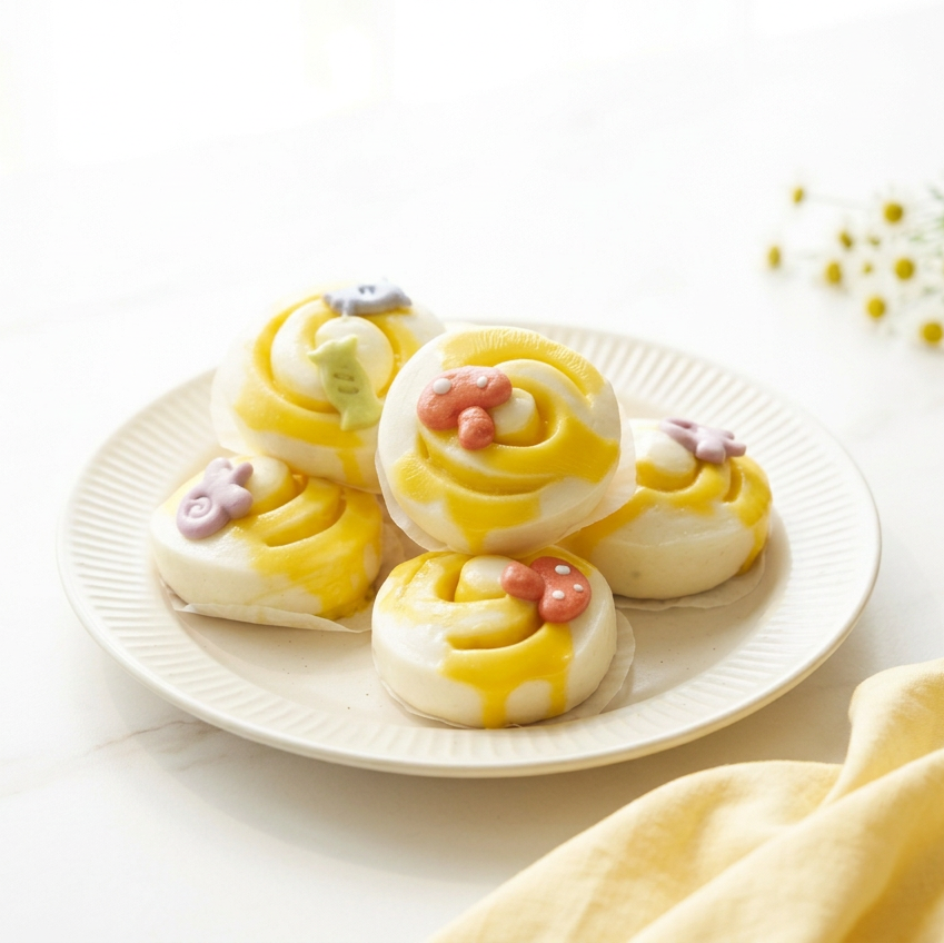 Cheese buns in a brighter, airy white café setting
